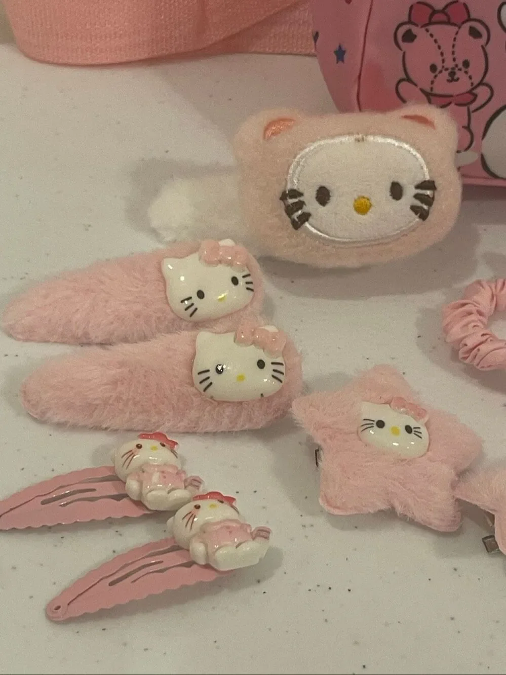 Hello Kitty mini back pack with 15 barrettes, hair clips and hair ties sticking
